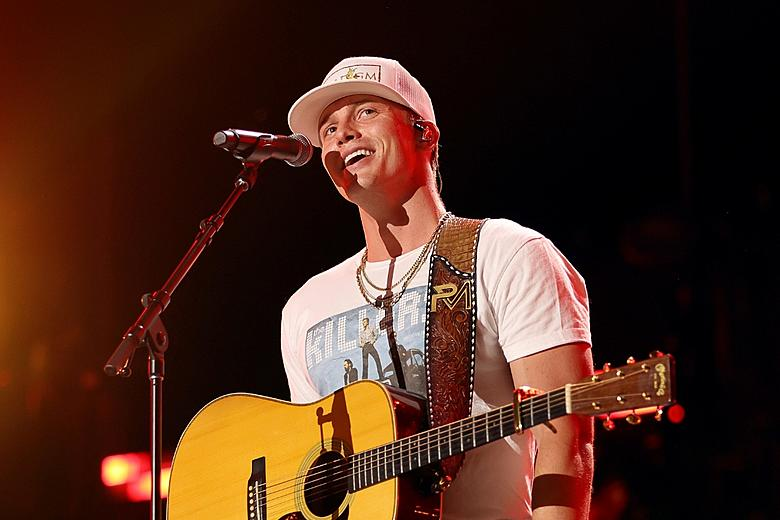 Parker McCollum siblings – country singer Parker McCollum performing on stage with family influence behind his career.