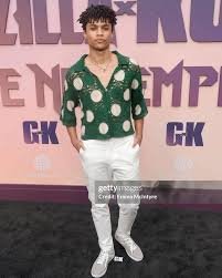 Lyon Daniels posing at a movie premiere event”