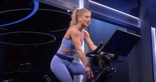 (title)% Peloton instructors leaving – indoor cycling class with energetic coach