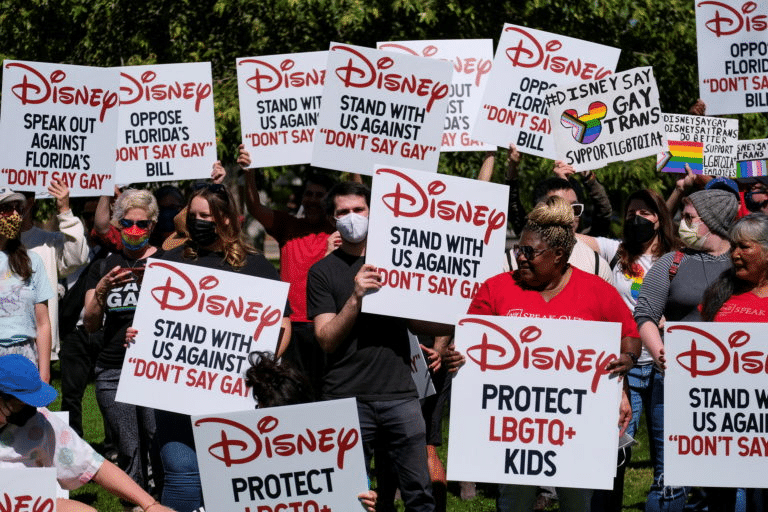 (title)% Protesters holding signs defending gay clubs and LGBTQ rights