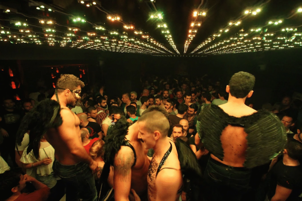 (title)% Gay sex club nightlife scene with neon lights and dancing crowd