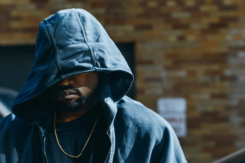 (title)% Kanye hoodie streetwear style in urban setting