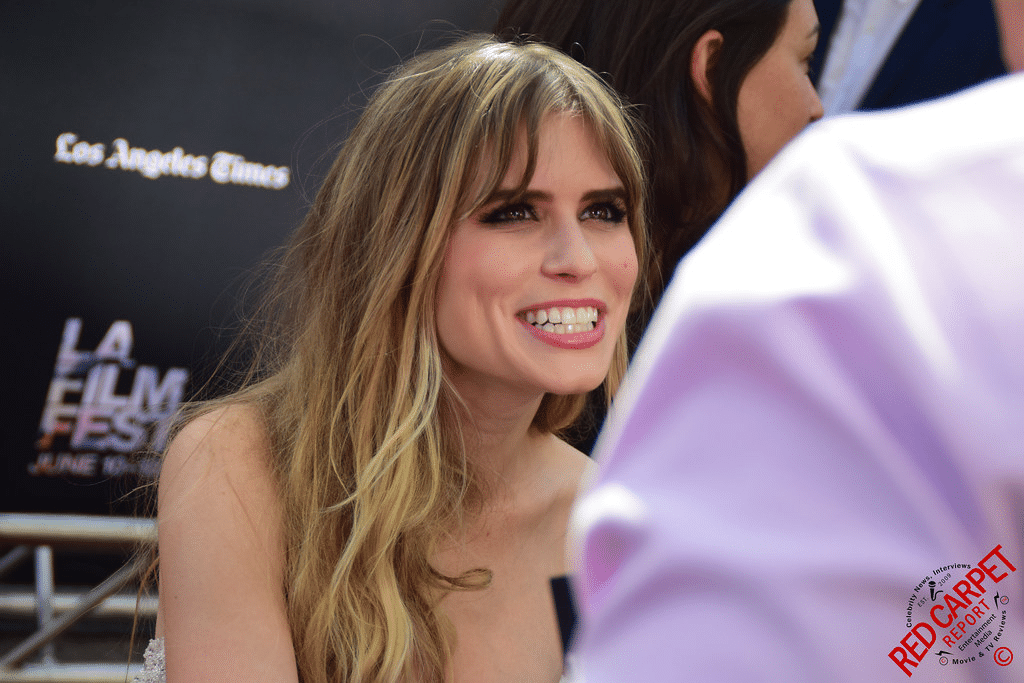 Carlson Young height at red carpet event