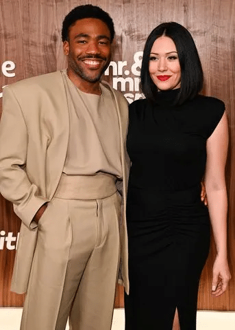 Daniel Glover wife alongside the actor at a public event