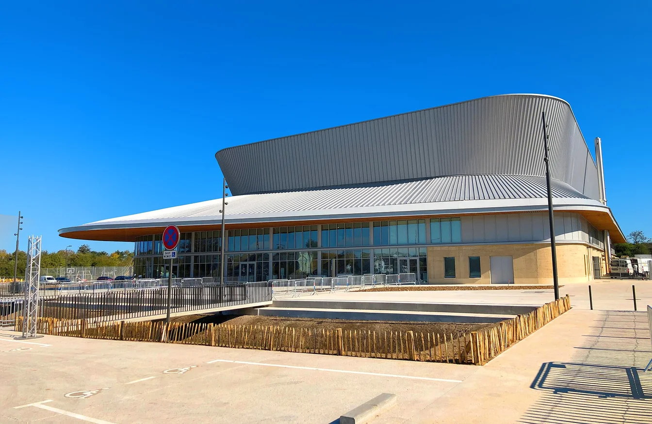 Frustrated concert fan staring at phone screen showing sold out tickets while bots steal inventory